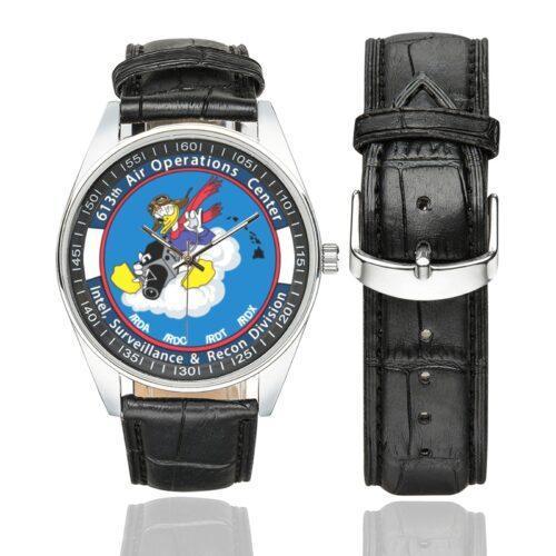 Men's casual watch with a round dial featuring the 613th Air Operations Center emblem, silver-tone case and black leather strap, shown with the strap to the side.