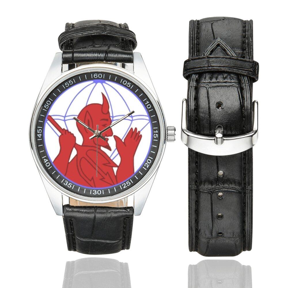 Men's casual watch with a round dial featuring the US Army 504th Parachute Infantry Regiment emblem, silver-tone case and black leather strap, shown with the strap to the side.