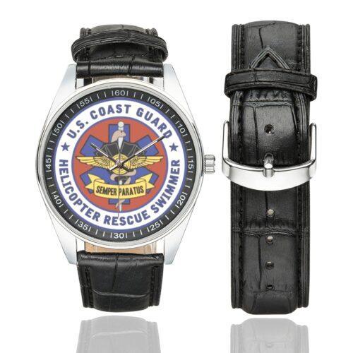 Men's casual watch with a round dial featuring the US Coast Guard Helicopter Rescue Swimmer emblem, silver-tone case and black leather strap, shown with the strap to the side.