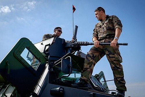 French soldiers wearing CCE camouflage with a VAB armoured vehicle, Bastille Day 2017