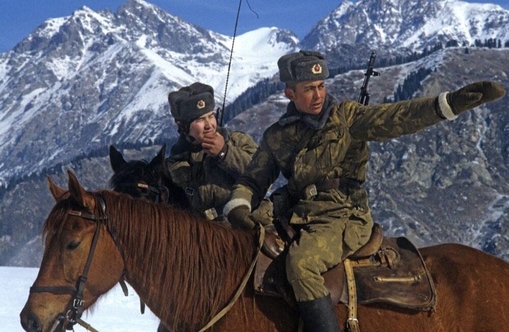 Soviet KGB border guards in KLMK leaf camouflage on horseback at the alpine section of the Khorgos Soviet-Chinese frontier post