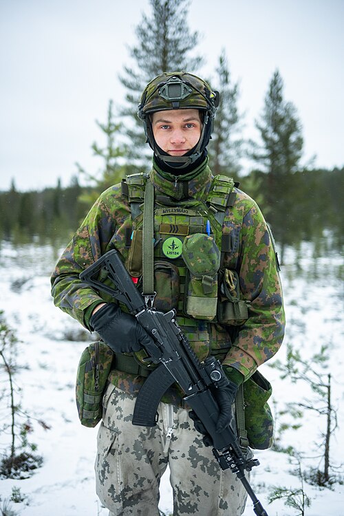 Portrait of a Finnish Army sergeant in M05 camouflage after firing a K9 self-propelled gun during an international exercise.