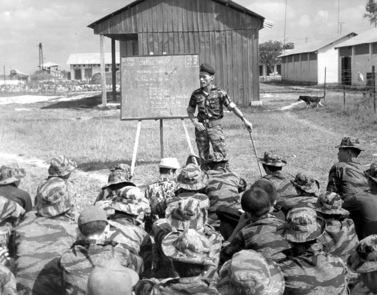 CIDG training class in tiger stripe boonie hats during the Vietnam War