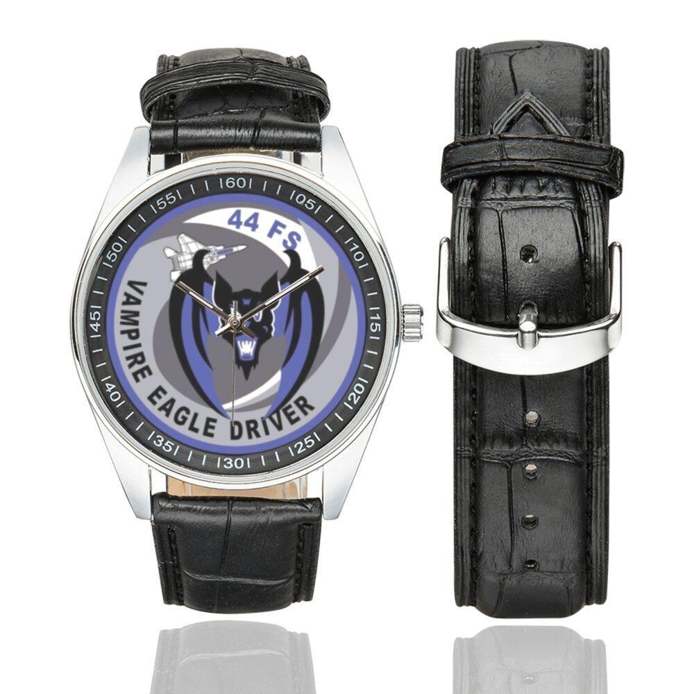 Men's casual watch with a round dial featuring the USAF 44th Fighter Squadron blue vampire bat skull with wings and a gray F-15 fighter jet on a silver-tone case with black leather strap.