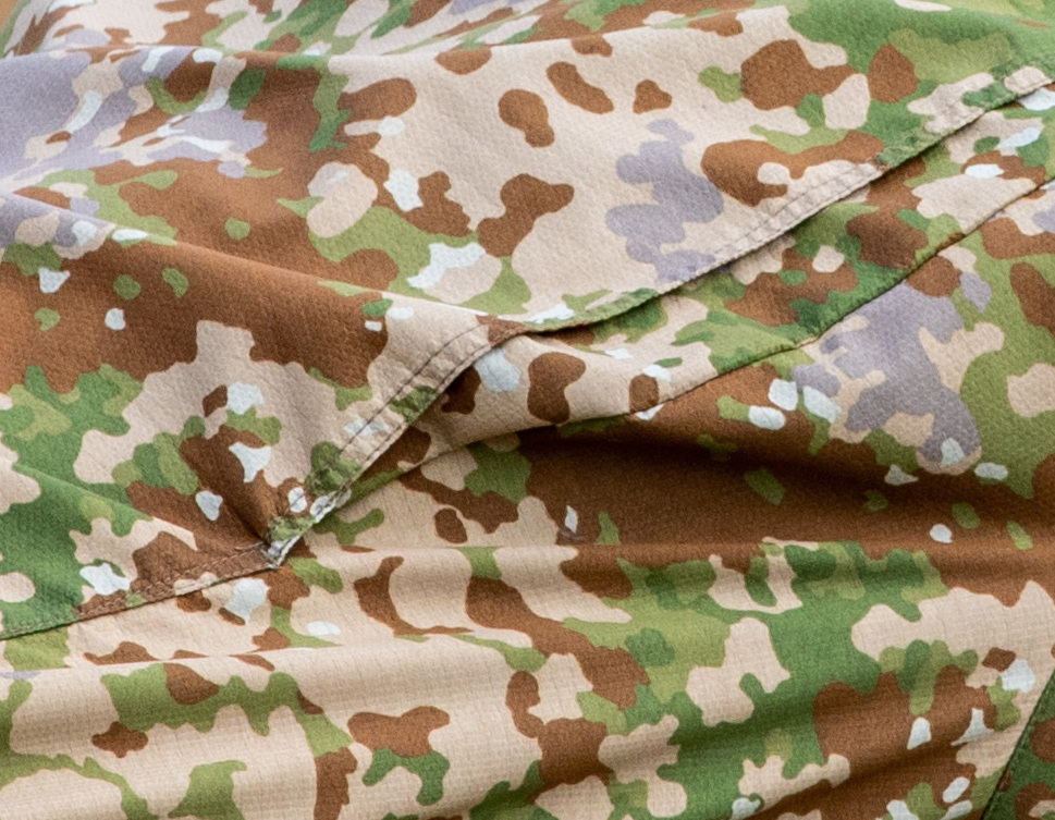 Close crop of a German special forces uniform in Multitarn, showing the six-colour pattern repeat without any black element