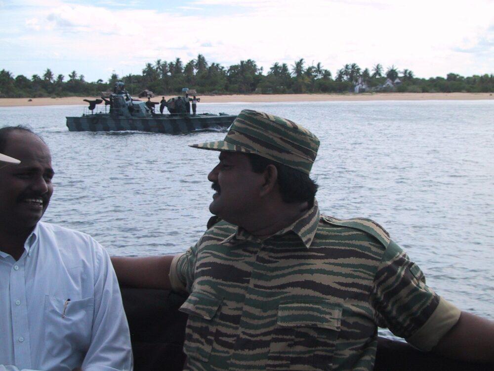 Sea Tiger commander Soosai in a striped camouflage shirt aboard a Sea Tigers fast attack craft off Mullaitivu, Sri Lanka, 2003