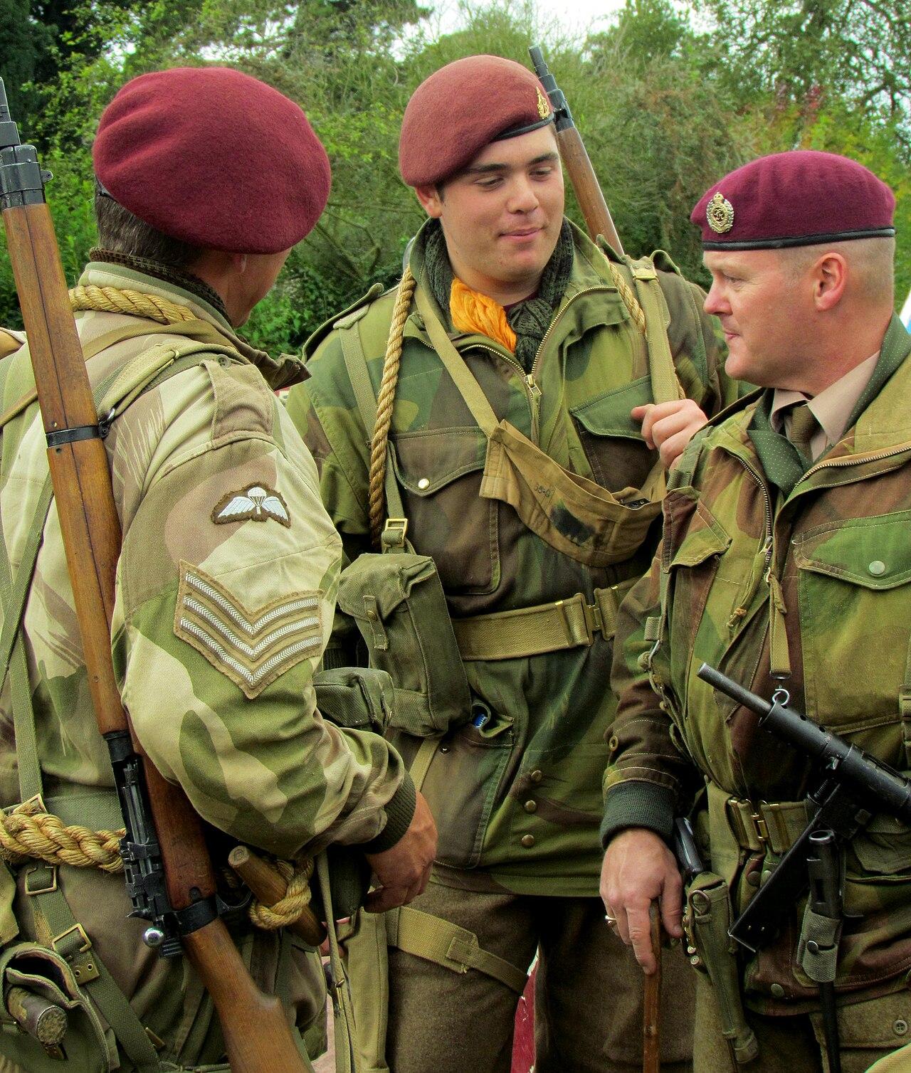 Re-enactors in Denison brushstroke camouflage smocks and airborne equipment