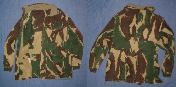 Flat-lay photograph of a 1959 Pattern Denison parachute smock, front and rear views, showing the brushstroke camouflage