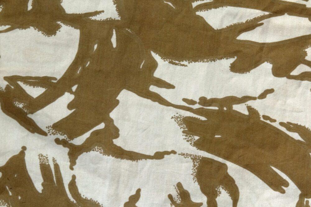 Close-up of British two-colour desert Disruptive Pattern Material, brown disruptive shapes on a sand ground