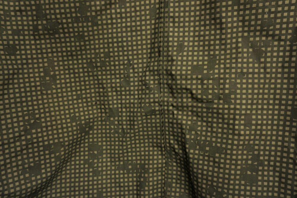 Close-up of a Desert Night Camouflage garment showing the two-colour night grid and cloth folds