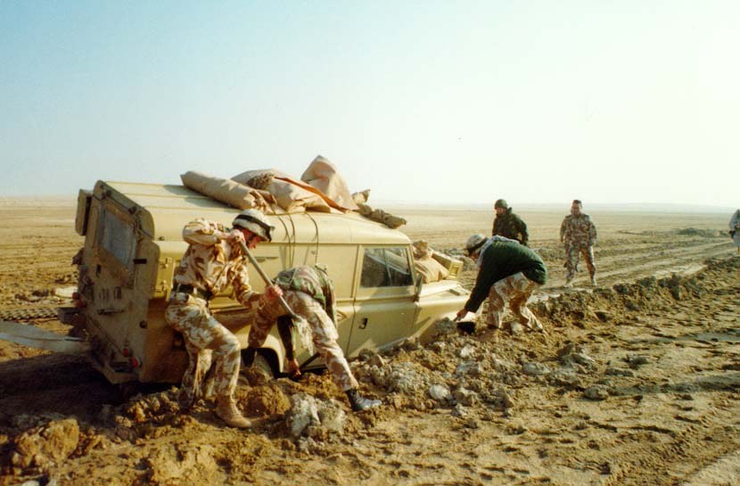 British soldiers of the 1st Armoured Division extract a stuck Land Rover during a live fire exercise in the Gulf War, January 1991