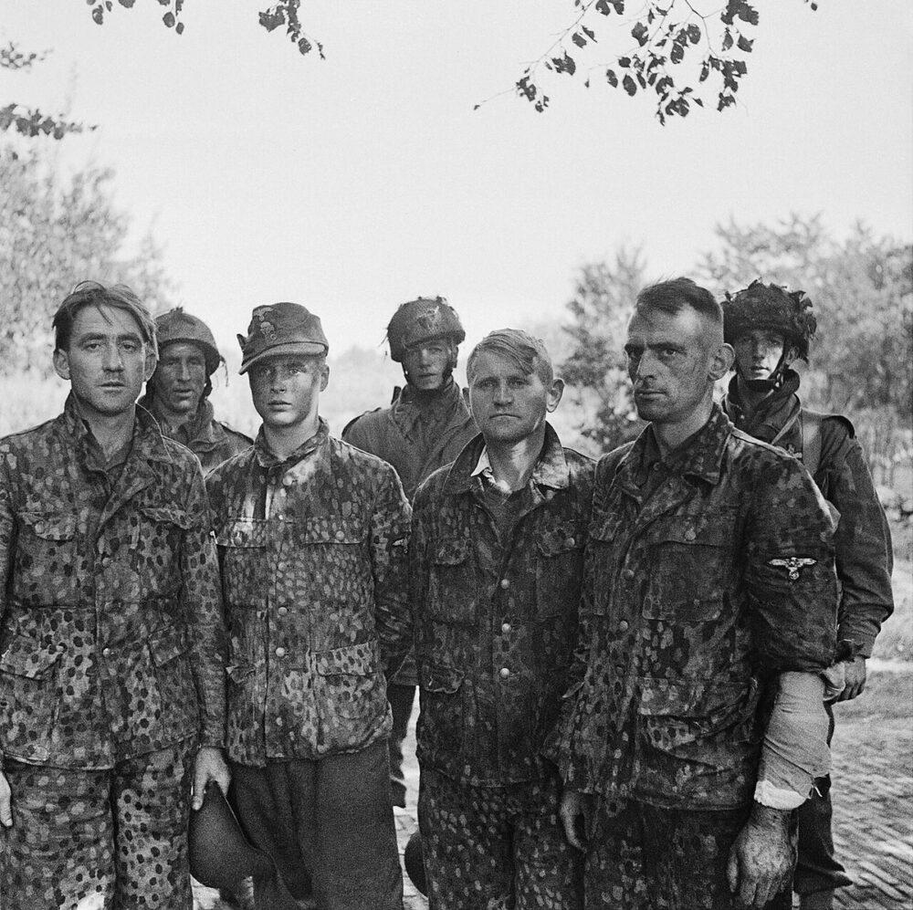 Waffen-SS prisoners captured at Arnhem in September 1944 wearing printed camouflage blouses