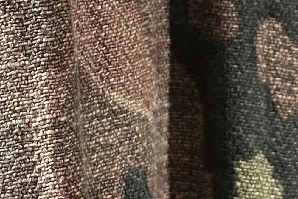 Close-up of the printed dot-raster camouflage cloth on an original Waffen-SS jacket, Danish War Museum