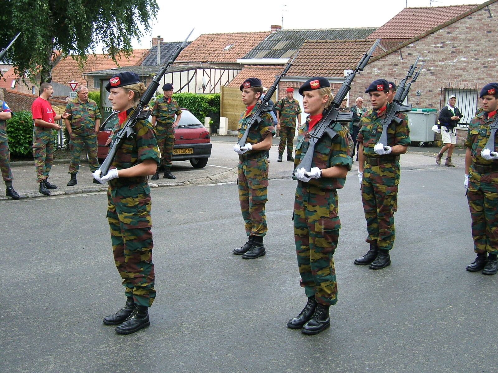 Belgian soldiers in jigsaw camouflage marching in a village parade, 2006