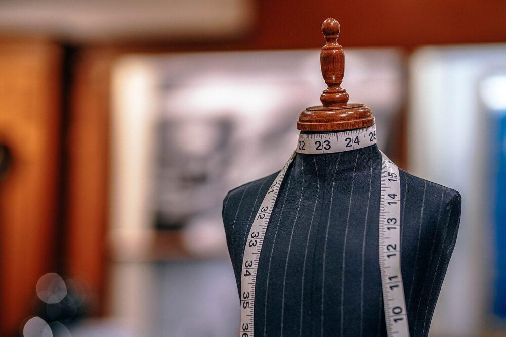 Tailor's measuring tape around the neck of a dress form