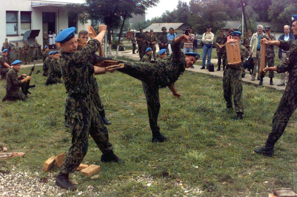Russian paratroopers in camouflage performing a martial-arts demonstration