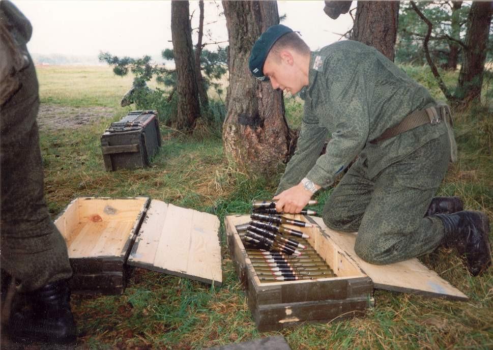 A Polish soldier wearing the wz. 89 Puma camouflage uniform loading ammunition for a ZU-23-2 anti-aircraft gun