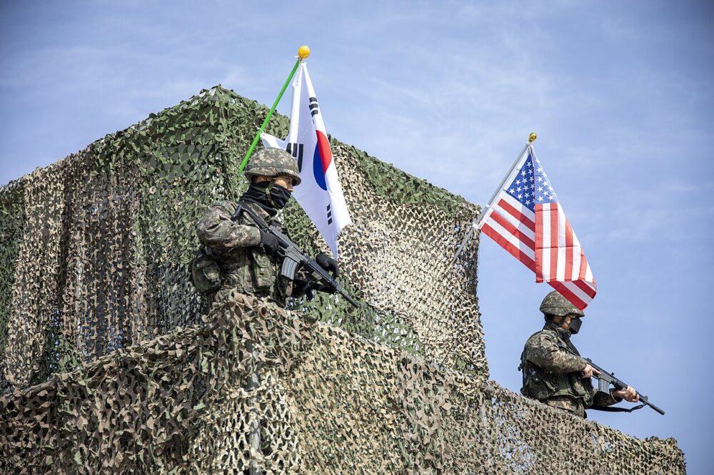 Republic of Korea Army soldiers in granite camouflage pulling security on high ground during Freedom Shield 2025 in South Korea