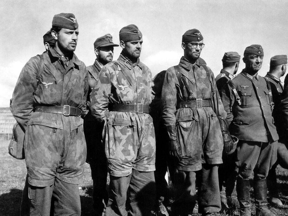 German officers after the surrender of Brest, September 1944, some wearing camouflage clothing over field-grey