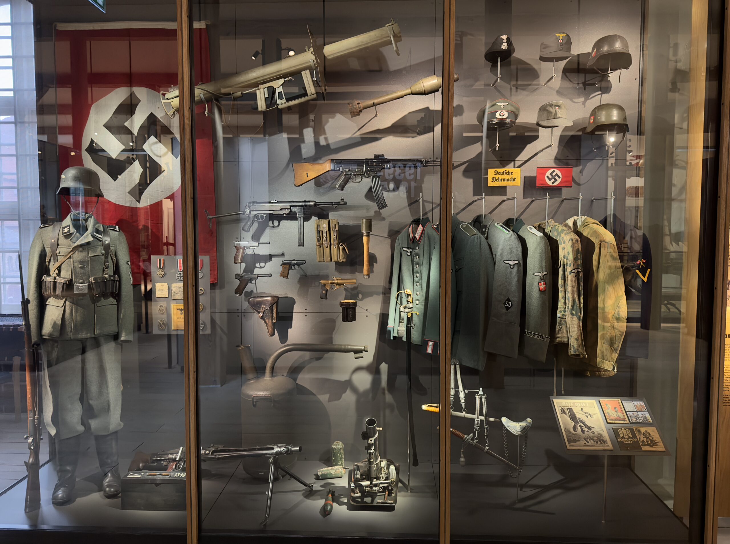 Camouflage garments on display in a glass case at the Danish War Museum, Copenhagen