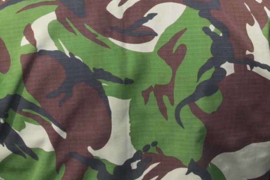 Close view of Indonesian Marine Corps DPM camouflage fabric in large blocks of green, dark red, black and cream