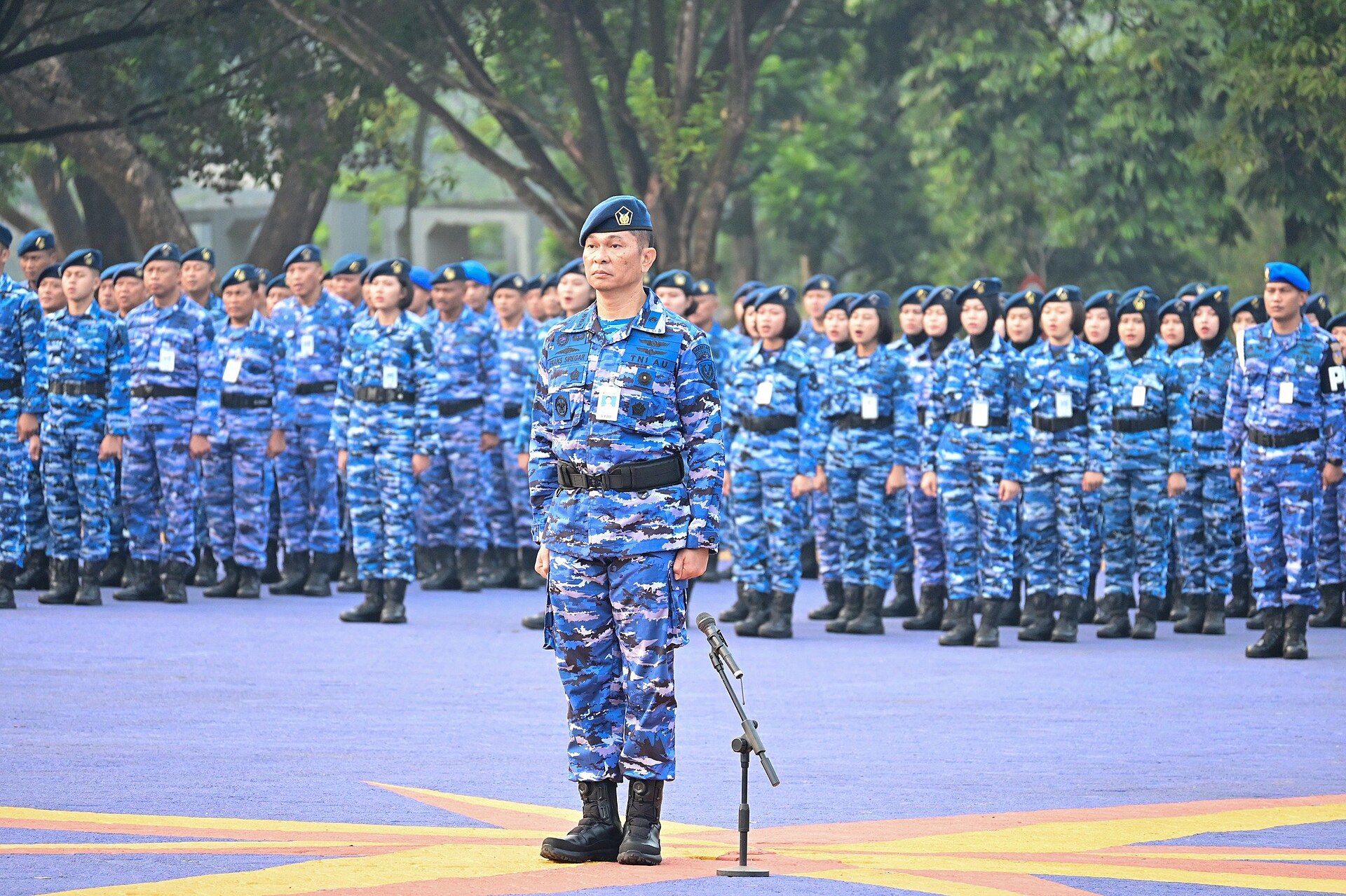 Indonesian Air Force personnel in blue digital camouflage with pale sand patches at Air Force Headquarters